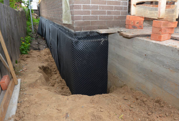 Happy homeowners after waterproofing job in Greentown